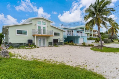 Full Duplex - A Fantastic Investment Opportunity! Live in one on Key Colony Beach Golf Course in Florida - for sale on GolfHomes.com, golf home, golf lot