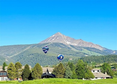 Charming and well-maintained end-unit condo featuring a cozy on Big Sky of Montana Golf Course in Montana - for sale on GolfHomes.com, golf home, golf lot