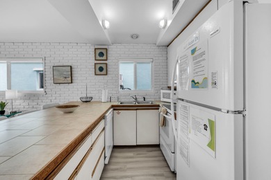 Full Duplex - A Fantastic Investment Opportunity! Live in one on Key Colony Beach Golf Course in Florida - for sale on GolfHomes.com, golf home, golf lot