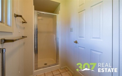 Set on .55 acres along the 16th hole of Olive Glenn Golf Course on Olive Glenn Golf and Country Club in Wyoming - for sale on GolfHomes.com, golf home, golf lot