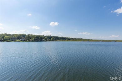 Enjoy stunning sunset lake views from this charming all-brick on Terre Du Lac Golf and Country Club in Missouri - for sale on GolfHomes.com, golf home, golf lot
