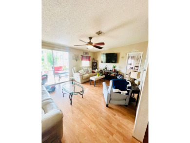 This charming two-bedroom, two-bathroom home is nestled in a on Pine Lakes Country Club in Florida - for sale on GolfHomes.com, golf home, golf lot
