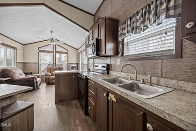 Come see this well-maintained 2017 park model camper located on on River Golf and Country Club at Lake Royale in North Carolina - for sale on GolfHomes.com, golf home, golf lot