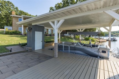 Enjoy stunning sunset lake views from this charming all-brick on Terre Du Lac Golf and Country Club in Missouri - for sale on GolfHomes.com, golf home, golf lot