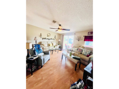 This charming two-bedroom, two-bathroom home is nestled in a on Pine Lakes Country Club in Florida - for sale on GolfHomes.com, golf home, golf lot