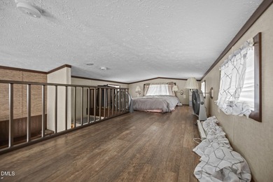 Come see this well-maintained 2017 park model camper located on on River Golf and Country Club at Lake Royale in North Carolina - for sale on GolfHomes.com, golf home, golf lot