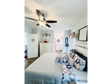 This charming two-bedroom, two-bathroom home is nestled in a on Pine Lakes Country Club in Florida - for sale on GolfHomes.com, golf home, golf lot