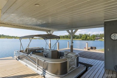 Enjoy stunning sunset lake views from this charming all-brick on Terre Du Lac Golf and Country Club in Missouri - for sale on GolfHomes.com, golf home, golf lot