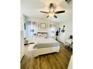 This charming two-bedroom, two-bathroom home is nestled in a on Pine Lakes Country Club in Florida - for sale on GolfHomes.com, golf home, golf lot