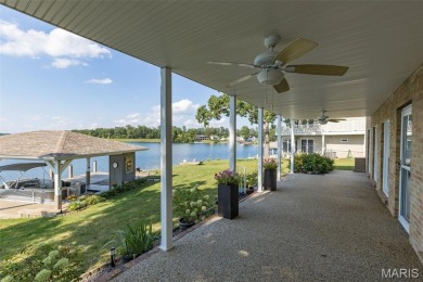 Enjoy stunning sunset lake views from this charming all-brick on Terre Du Lac Golf and Country Club in Missouri - for sale on GolfHomes.com, golf home, golf lot