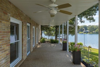 Enjoy stunning sunset lake views from this charming all-brick on Terre Du Lac Golf and Country Club in Missouri - for sale on GolfHomes.com, golf home, golf lot