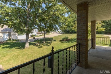 Enjoy stunning sunset lake views from this charming all-brick on Terre Du Lac Golf and Country Club in Missouri - for sale on GolfHomes.com, golf home, golf lot