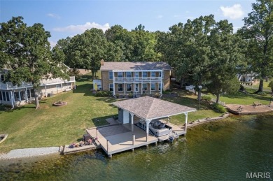 Enjoy stunning sunset lake views from this charming all-brick on Terre Du Lac Golf and Country Club in Missouri - for sale on GolfHomes.com, golf home, golf lot