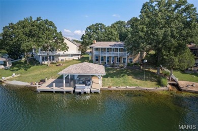 Enjoy stunning sunset lake views from this charming all-brick on Terre Du Lac Golf and Country Club in Missouri - for sale on GolfHomes.com, golf home, golf lot
