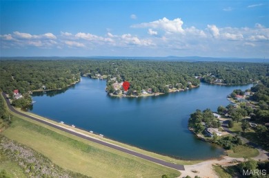 Enjoy stunning sunset lake views from this charming all-brick on Terre Du Lac Golf and Country Club in Missouri - for sale on GolfHomes.com, golf home, golf lot