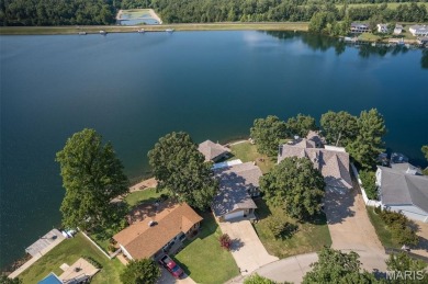 Enjoy stunning sunset lake views from this charming all-brick on Terre Du Lac Golf and Country Club in Missouri - for sale on GolfHomes.com, golf home, golf lot