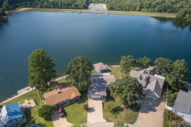 Enjoy stunning sunset lake views from this charming all-brick on Terre Du Lac Golf and Country Club in Missouri - for sale on GolfHomes.com, golf home, golf lot