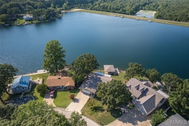 Enjoy stunning sunset lake views from this charming all-brick on Terre Du Lac Golf and Country Club in Missouri - for sale on GolfHomes.com, golf home, golf lot