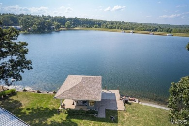 Enjoy stunning sunset lake views from this charming all-brick on Terre Du Lac Golf and Country Club in Missouri - for sale on GolfHomes.com, golf home, golf lot