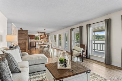 Enjoy stunning sunset lake views from this charming all-brick on Terre Du Lac Golf and Country Club in Missouri - for sale on GolfHomes.com, golf home, golf lot