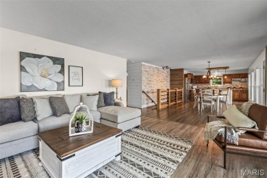 Enjoy stunning sunset lake views from this charming all-brick on Terre Du Lac Golf and Country Club in Missouri - for sale on GolfHomes.com, golf home, golf lot