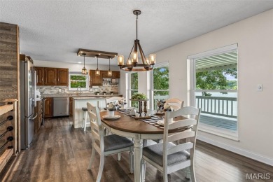 Enjoy stunning sunset lake views from this charming all-brick on Terre Du Lac Golf and Country Club in Missouri - for sale on GolfHomes.com, golf home, golf lot