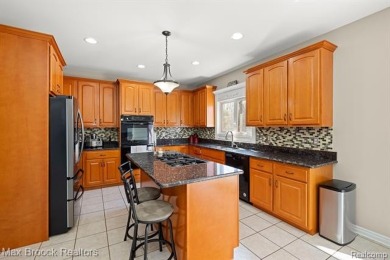 Welcome to this stunning colonial brick home in the highly on The Orchards Golf Club in Michigan - for sale on GolfHomes.com, golf home, golf lot