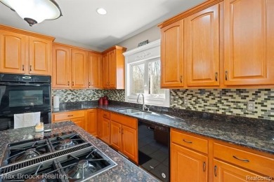 Welcome to this stunning colonial brick home in the highly on The Orchards Golf Club in Michigan - for sale on GolfHomes.com, golf home, golf lot