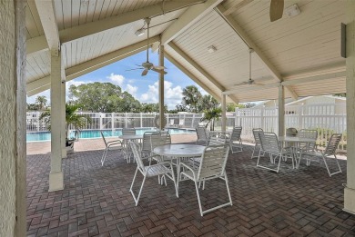 Nestled within the serene waterfront Mariners Pass community on Mangrove Bay Golf Course in Florida - for sale on GolfHomes.com, golf home, golf lot