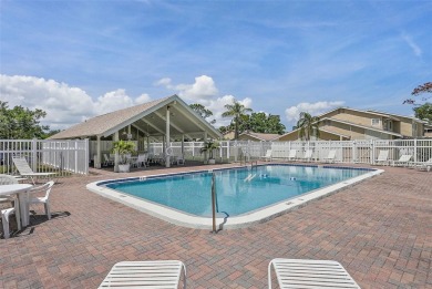 Nestled within the serene waterfront Mariners Pass community on Mangrove Bay Golf Course in Florida - for sale on GolfHomes.com, golf home, golf lot