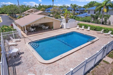 Nestled within the serene waterfront Mariners Pass community on Mangrove Bay Golf Course in Florida - for sale on GolfHomes.com, golf home, golf lot