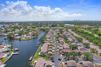 Nestled within the serene waterfront Mariners Pass community on Mangrove Bay Golf Course in Florida - for sale on GolfHomes.com, golf home, golf lot