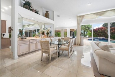 Experience the charm of this exquisite home, set on a stunning on Bocaire Country Club in Florida - for sale on GolfHomes.com, golf home, golf lot