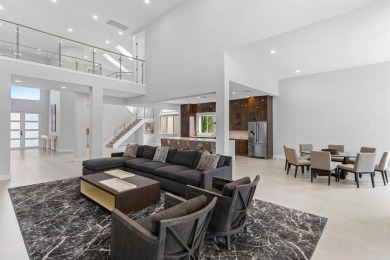 Step into this exquisitely renovated home, where modern design on Polo Club of Boca Raton in Florida - for sale on GolfHomes.com, golf home, golf lot