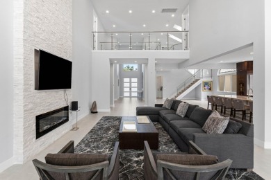 Step into this exquisitely renovated home, where modern design on Polo Club of Boca Raton in Florida - for sale on GolfHomes.com, golf home, golf lot