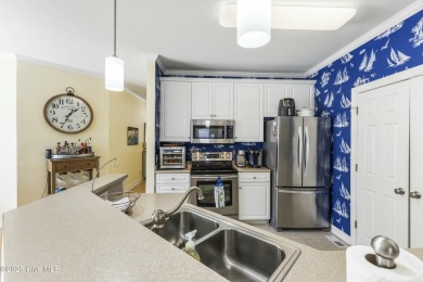 A stunning first floor condo in the Osprey Creek section of Sea on Sea Trail Golf Resort in North Carolina - for sale on GolfHomes.com, golf home, golf lot