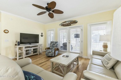 A stunning first floor condo in the Osprey Creek section of Sea on Sea Trail Golf Resort in North Carolina - for sale on GolfHomes.com, golf home, golf lot