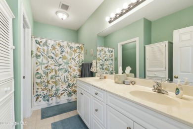 A stunning first floor condo in the Osprey Creek section of Sea on Sea Trail Golf Resort in North Carolina - for sale on GolfHomes.com, golf home, golf lot