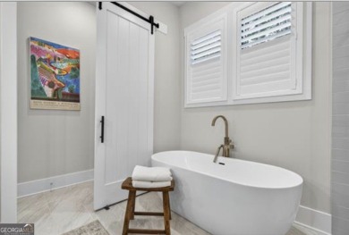 Experience elegance and privacy in this immaculate 4-bedroom, 3 on Harbor Club Golf and Country Club in Georgia - for sale on GolfHomes.com, golf home, golf lot