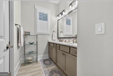 Experience elegance and privacy in this immaculate 4-bedroom, 3 on Harbor Club Golf and Country Club in Georgia - for sale on GolfHomes.com, golf home, golf lot