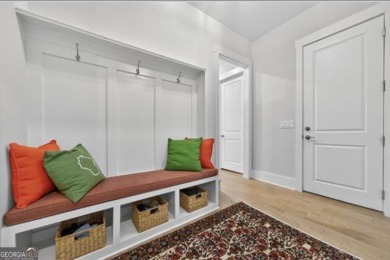 Experience elegance and privacy in this immaculate 4-bedroom, 3 on Harbor Club Golf and Country Club in Georgia - for sale on GolfHomes.com, golf home, golf lot