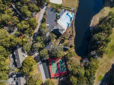 A stunning first floor condo in the Osprey Creek section of Sea on Sea Trail Golf Resort in North Carolina - for sale on GolfHomes.com, golf home, golf lot