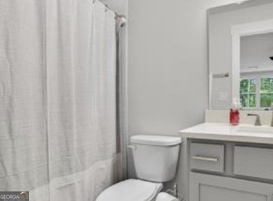 Experience elegance and privacy in this immaculate 4-bedroom, 3 on Harbor Club Golf and Country Club in Georgia - for sale on GolfHomes.com, golf home, golf lot