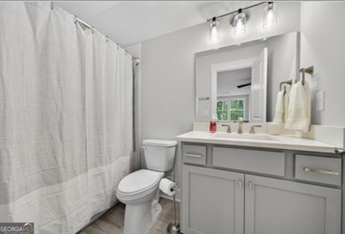 Experience elegance and privacy in this immaculate 4-bedroom, 3 on Harbor Club Golf and Country Club in Georgia - for sale on GolfHomes.com, golf home, golf lot