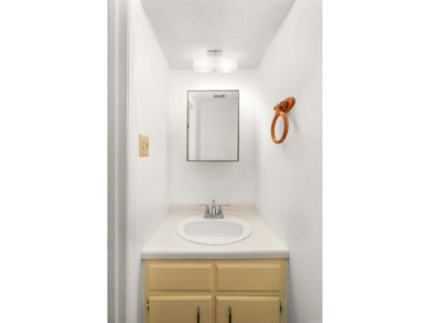 Main level includes living/dining room, kitchen and half bath on DeSoto Golf Course in Arkansas - for sale on GolfHomes.com, golf home, golf lot