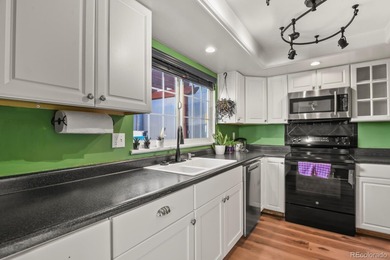 Beautifully updated townhome overlooking the 11th-hole fairway on Golf Club At Heather Ridge in Colorado - for sale on GolfHomes.com, golf home, golf lot