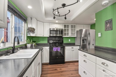 Beautifully updated townhome overlooking the 11th-hole fairway on Golf Club At Heather Ridge in Colorado - for sale on GolfHomes.com, golf home, golf lot