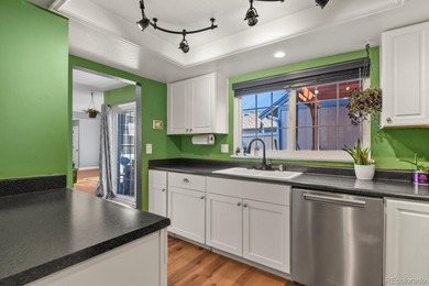 Beautifully updated townhome overlooking the 11th-hole fairway on Golf Club At Heather Ridge in Colorado - for sale on GolfHomes.com, golf home, golf lot