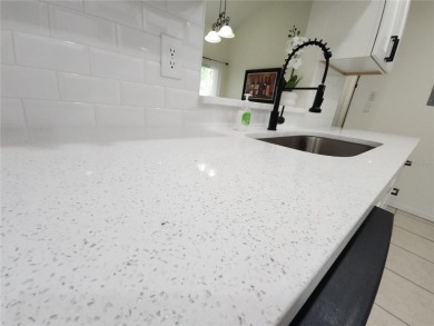 One or more photos is virtually staged!**PRIDE OF OWNERSHIP ( 24 on Cove Cay Country Club in Florida - for sale on GolfHomes.com, golf home, golf lot