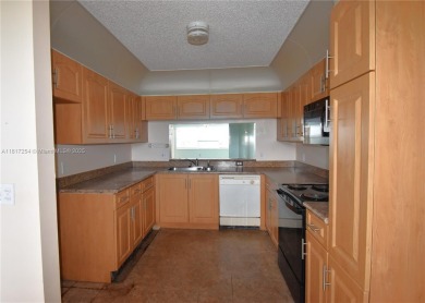 Spacious 2-bedroom 2 bath condo offers a good size kitchen with on Sunrise Lakes Phase IV Golf Course in Florida - for sale on GolfHomes.com, golf home, golf lot